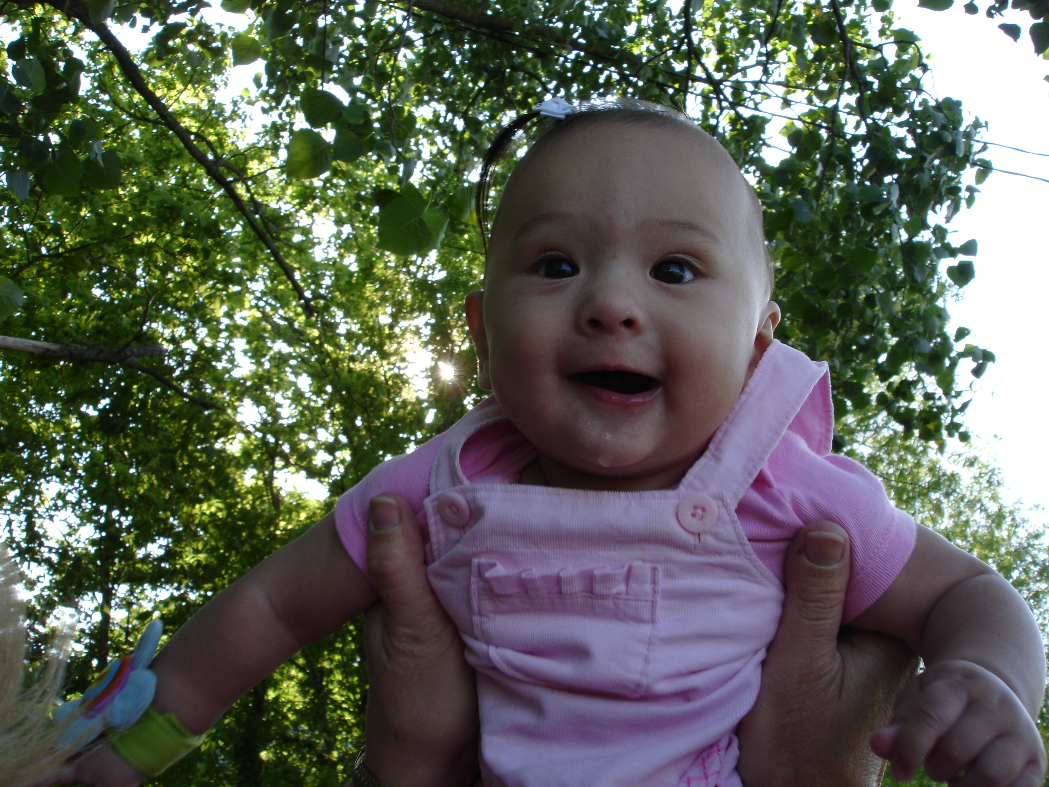 Baby Emma laughing outdoors