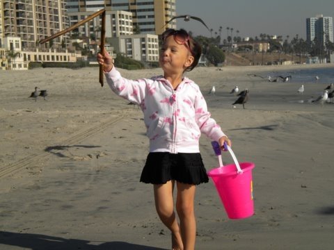 Emma at the beach as a toddler