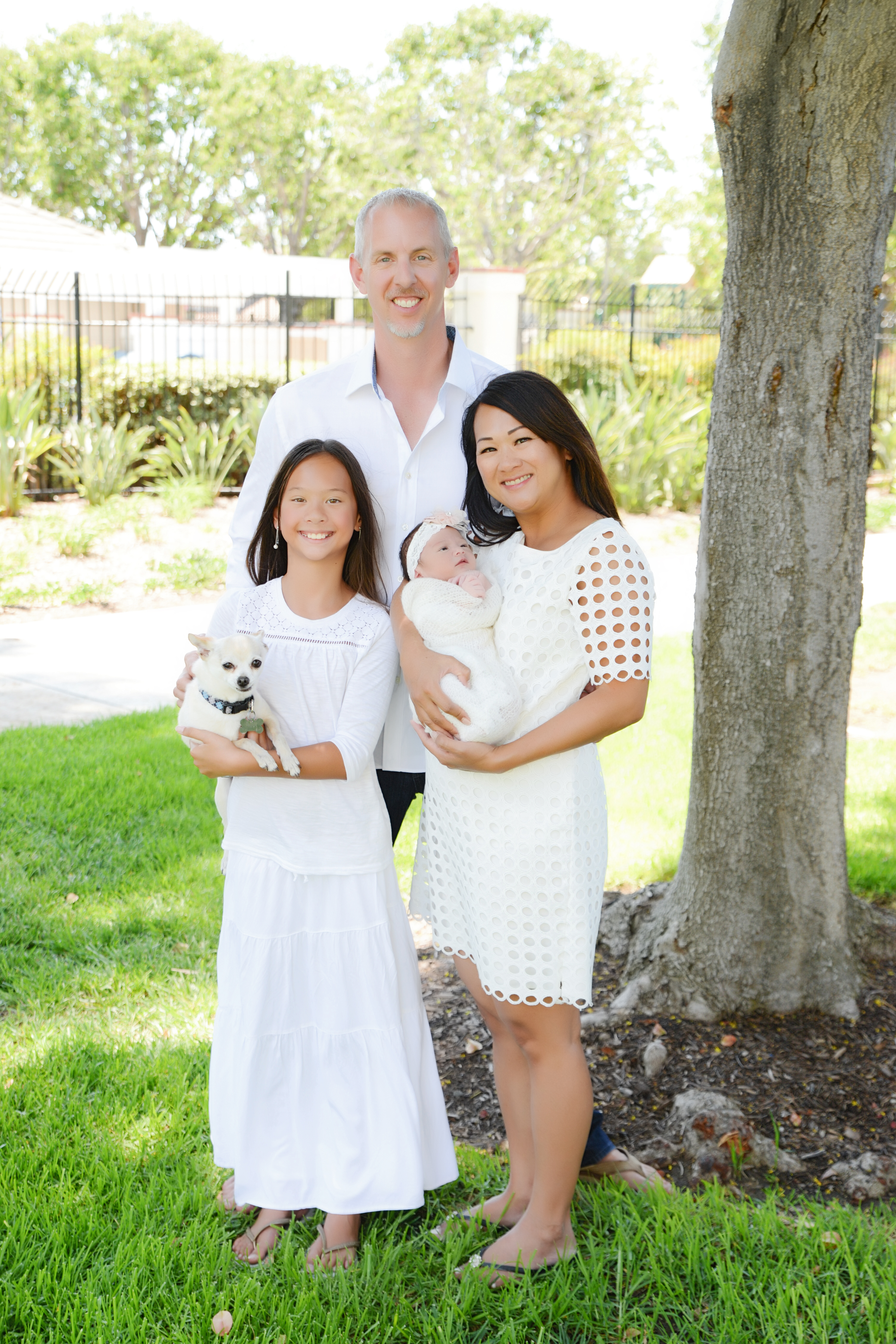 Family portrait with newborn Chloe, Emma, and the dog