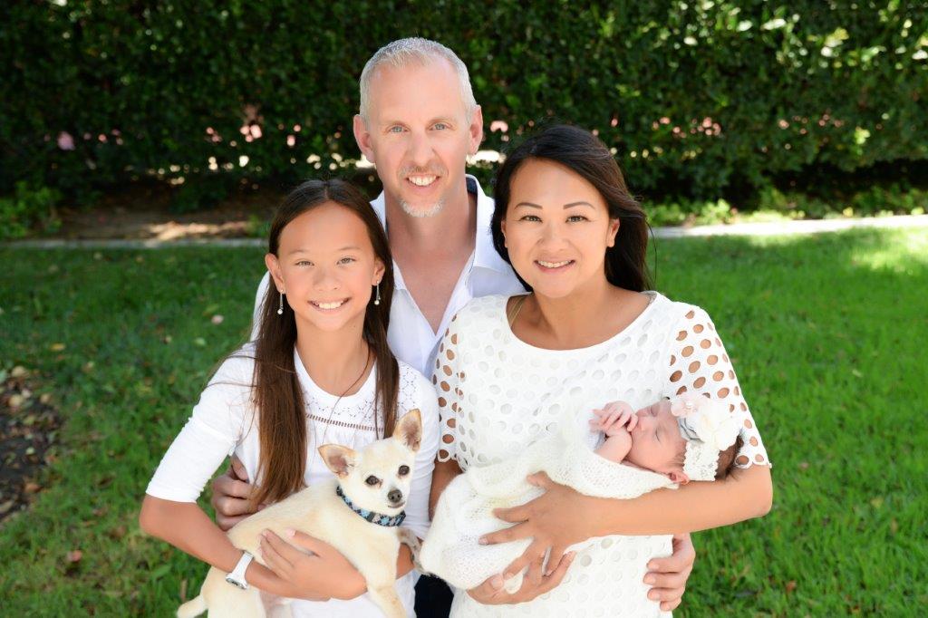 Family portrait with newborn Chloe, Emma, and the dog