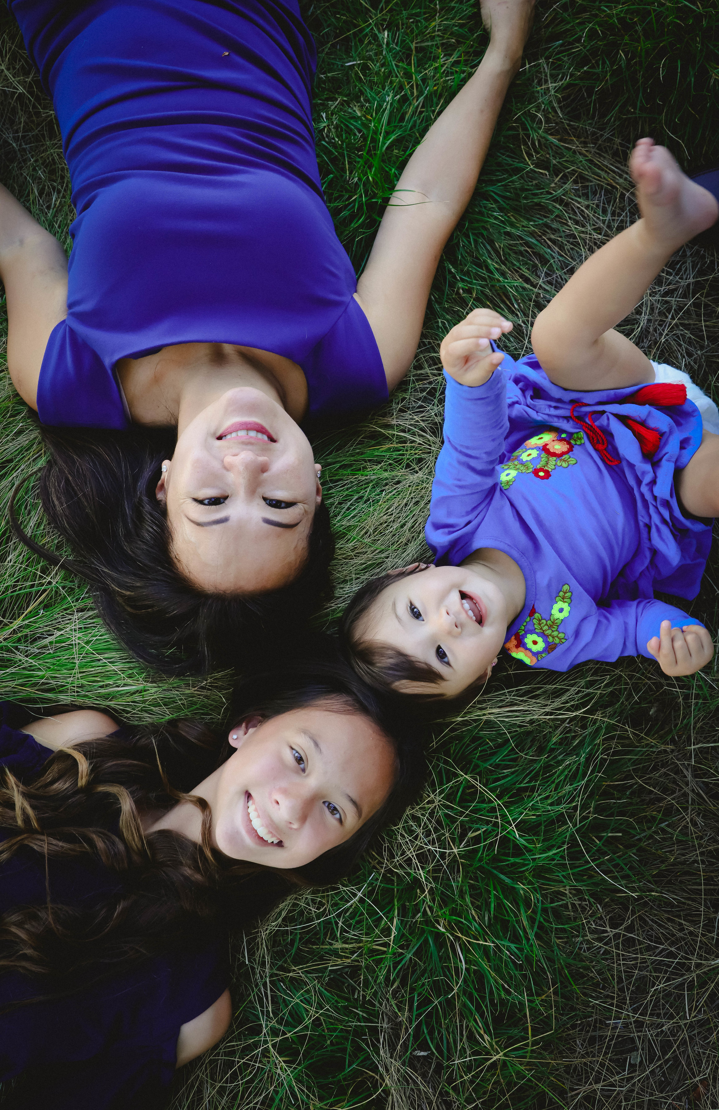 Emma and Chloe lying in the grass