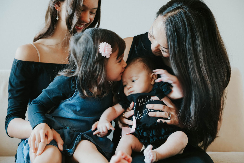 Chloe kissing baby Riley