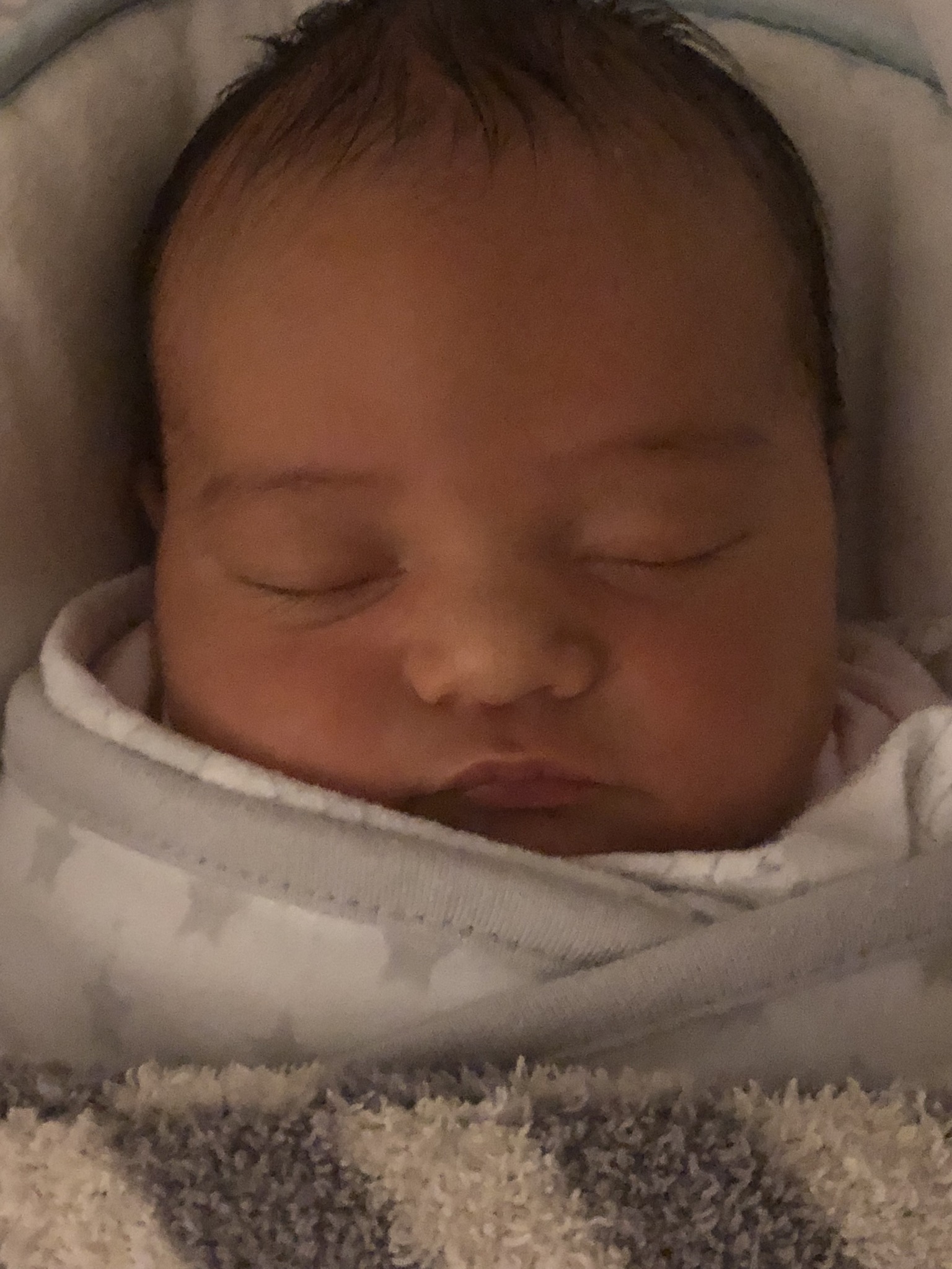 Newborn Riley asleep, close up