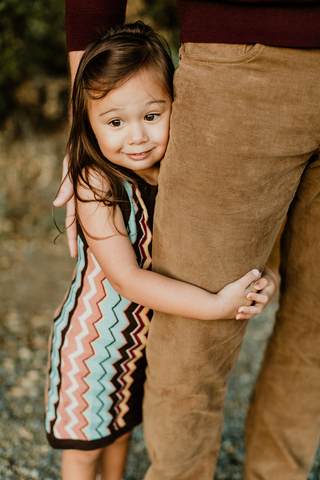Chloe hugging Sean's leg