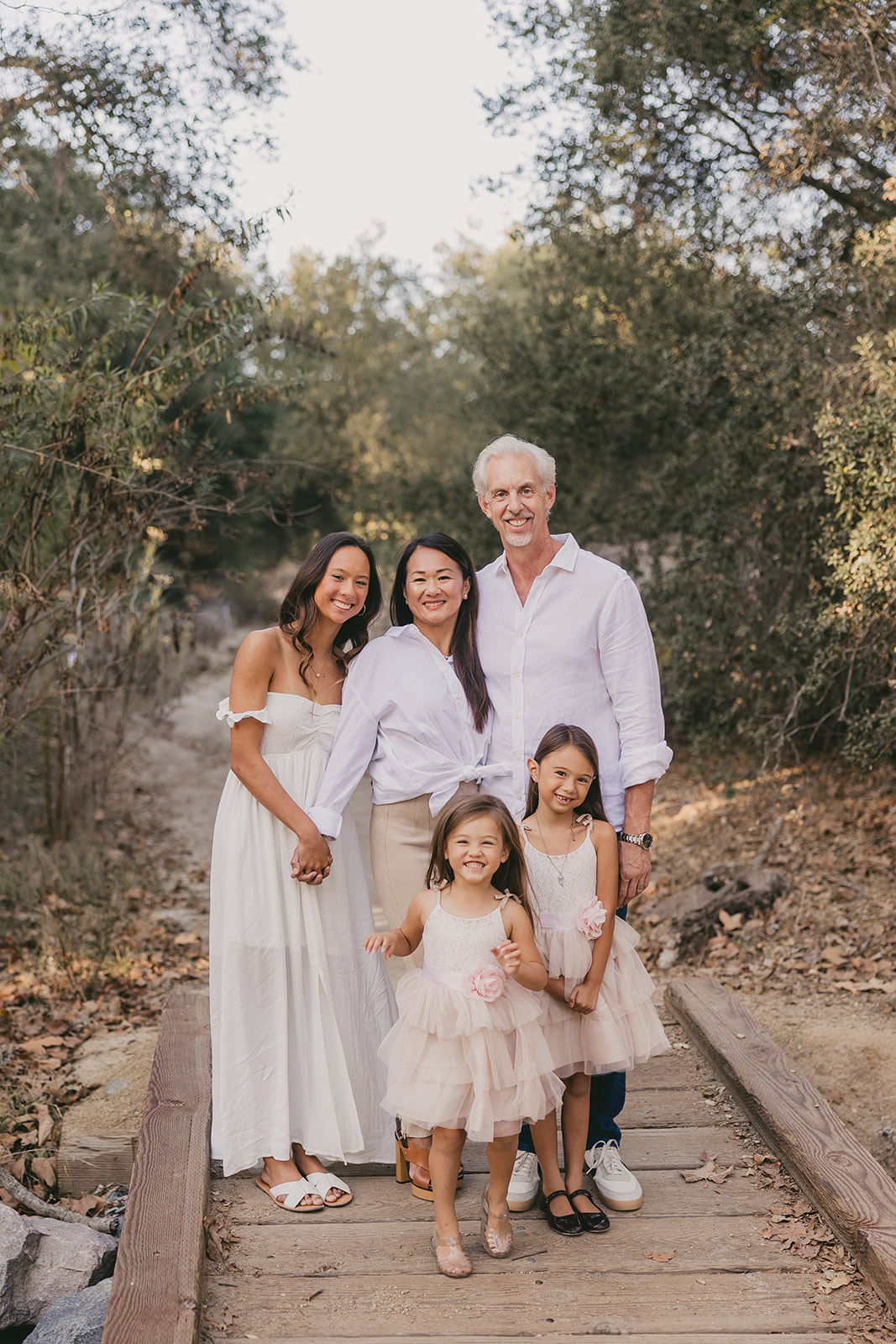 The family of five on a wooden footbridge
