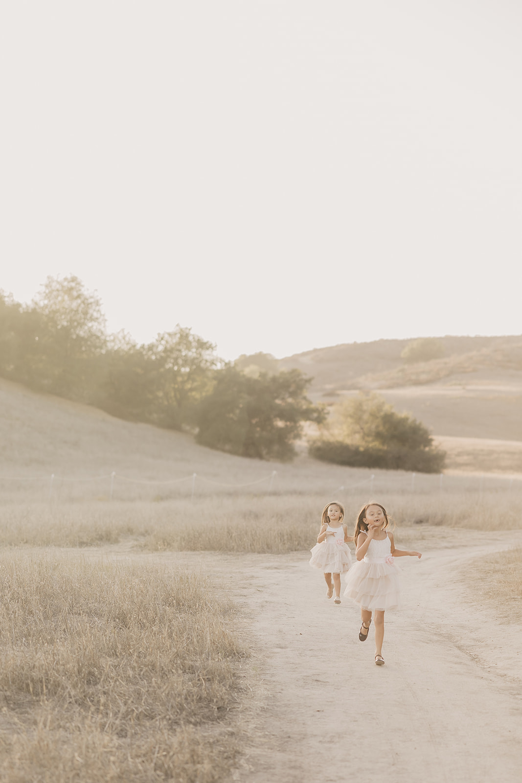 Chloe and Riley running down a path